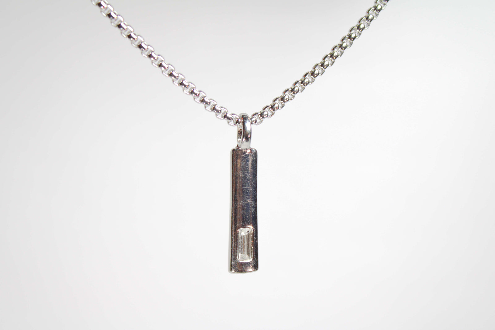 Baguette Bar layered Cuban chain necklace.