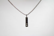 Baguette Bar layered Cuban chain necklace.